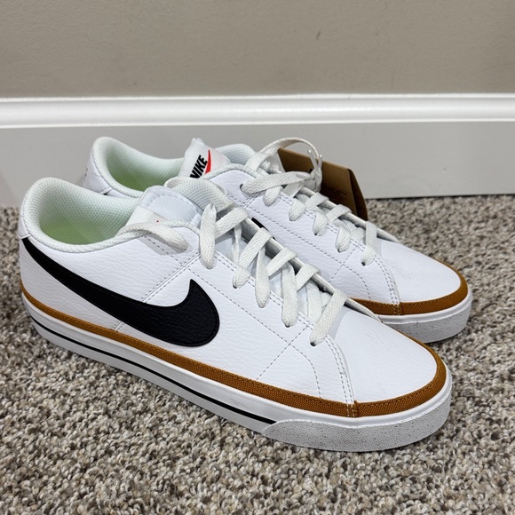 Nike Shoes - Nike White Low-Top Sneakers with Black Swoosh and Brown Trim